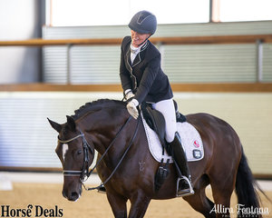 Rosann Tyler giving Sandro Bliss a well-deserved pat after their dressage test.