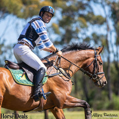 Shane Rose always has time for a smile and wave, even during his cross country round aboard Stakkino.