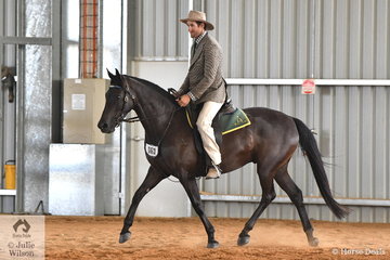 Andrew Walker is pictured aboard Kim McCallum's, 'Viewhill Solar" during the Stephens Pasture Seeds Four Year Old Maturity.