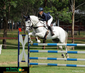 Soaring over the second fence in the combination Junior rider Charlotte Lalak and Topper II have their concentration faces on during the Show Jumping phase of the CCN2 Star class. 