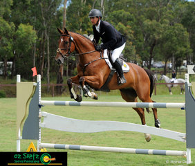 Looking towards the finish flags, Andrew Barnett and Go Tosca come through the final combination of the CCN2 Star Show Jumping phase of the Sydney Eventing Summer Classic.