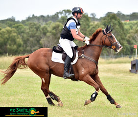 Cantering off after the Rustic Hut in the CCN3 Star cross country was Shaun Dillon on Another Biscuit at the Sydney Eventing Summer CLassic. 