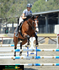 A beautiful pairing in the Class 6A 90cm Open at the 2019 Sydney Summer Classic was Katie Laurie riding her mare Queen Bee GNZ.