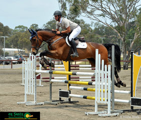 Flying over the triple bar in the open 1.10m was Cosmerex Coffee Vinchino with Clinton Van Der Sanden in the saddle.