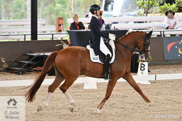 Sally Rizzuto is pictured aboard Vicki Newam's successful Diamond Hit gelding, 'Diamiond Star' during the Willinga Park Grand Prix CDI4*.