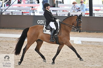 Sally Evans rode her home bred , 'A Spider Bite' by A'Seduction to fifth place in the Grand Prix Freestyle CDN.