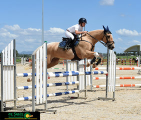 The crowd was left asking how she did it - Elkee Lang-McMahon from Kolora Lodge and 'Flash Az' took an impressive angle onto the final fence in the Open 1m AM5 Jump Off round to come home with a time of 36.55 and taking first place.