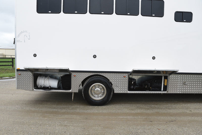More storage. The high gloss one piece fiberglass side of the truck is covered with a 3M product called Clear Guard. “I did not want to put press studs or tracking for a vinyl protection sheet. The Clear Guard that Tony Bayley put us onto protects the sides when horses are tied to it. It is a kind of self-repairing plastic that can be replaced.”