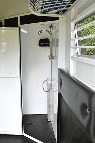 The shower room with electric hot water. “This is wonderful, as we can keep the whole float warm and we just get out of bed and go and have a shower, all in the warm.” The shower room also provides storage and especially wet storage because of the rubber floor and drain. The float carries 61L of water.