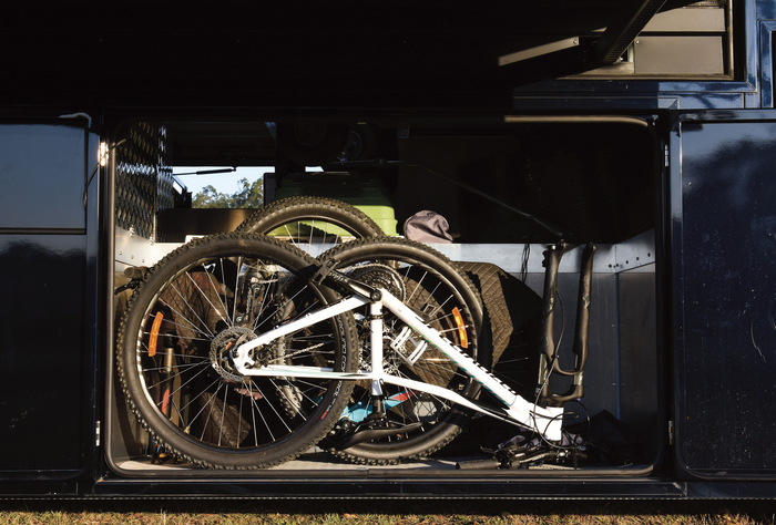One of the many storage boxes underneath carries the family’s bikes — the ultimate transport for getting around larger venues.