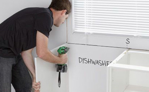 Continue to secure the kitchen cabinets