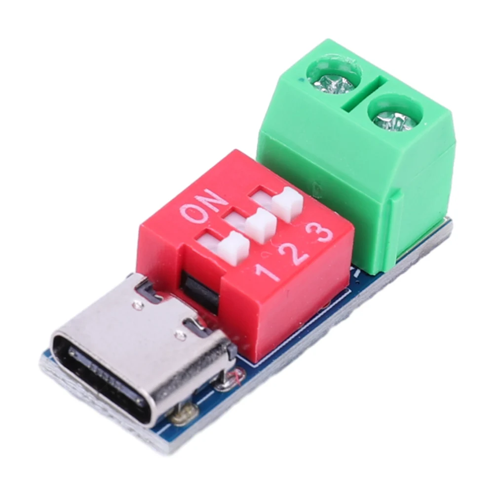 A picture of a small PCB with a USB-C socket on one end, a red three-DIP switch in the centre, and a green 2-terminal block at the other end.