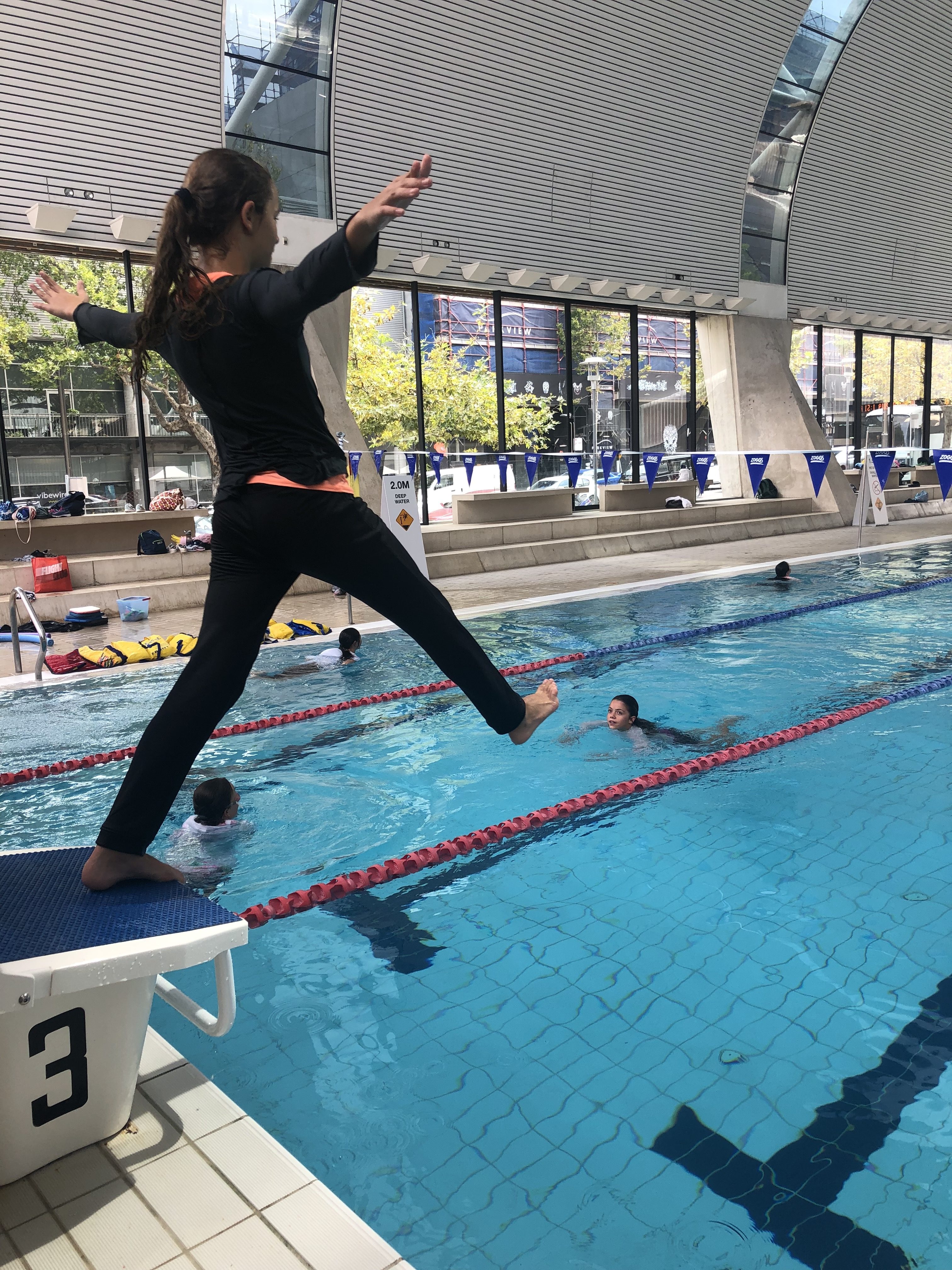 igs-water-safety-skills-group-in-pool-activities-jump