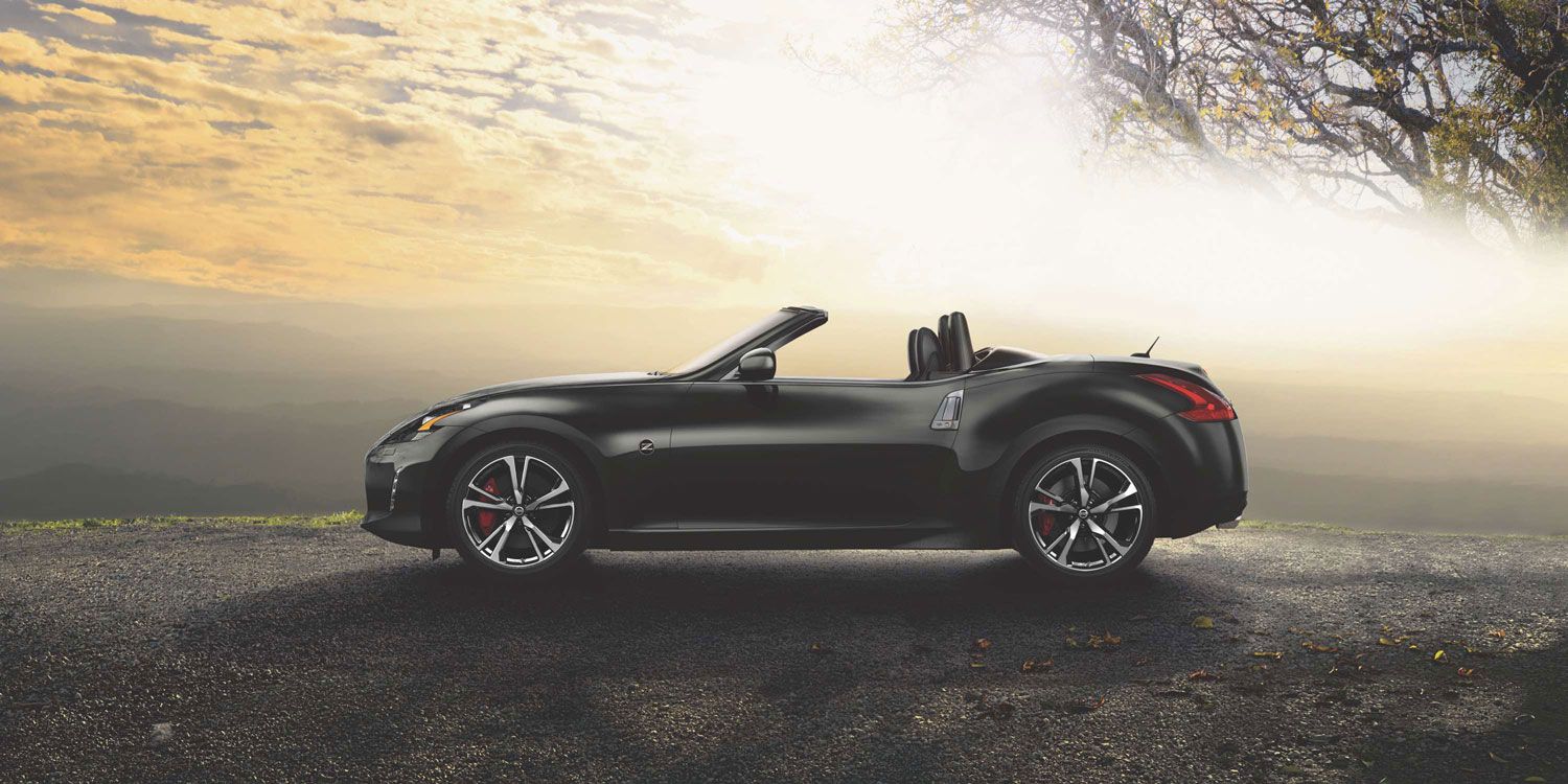 Nissan Roadster at scenic overlook at sunset