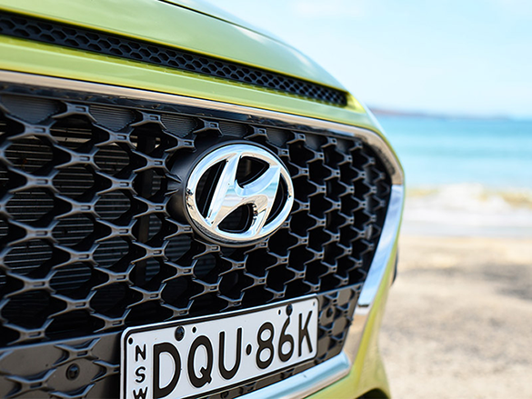 Cascading front grille with mesh pattern.