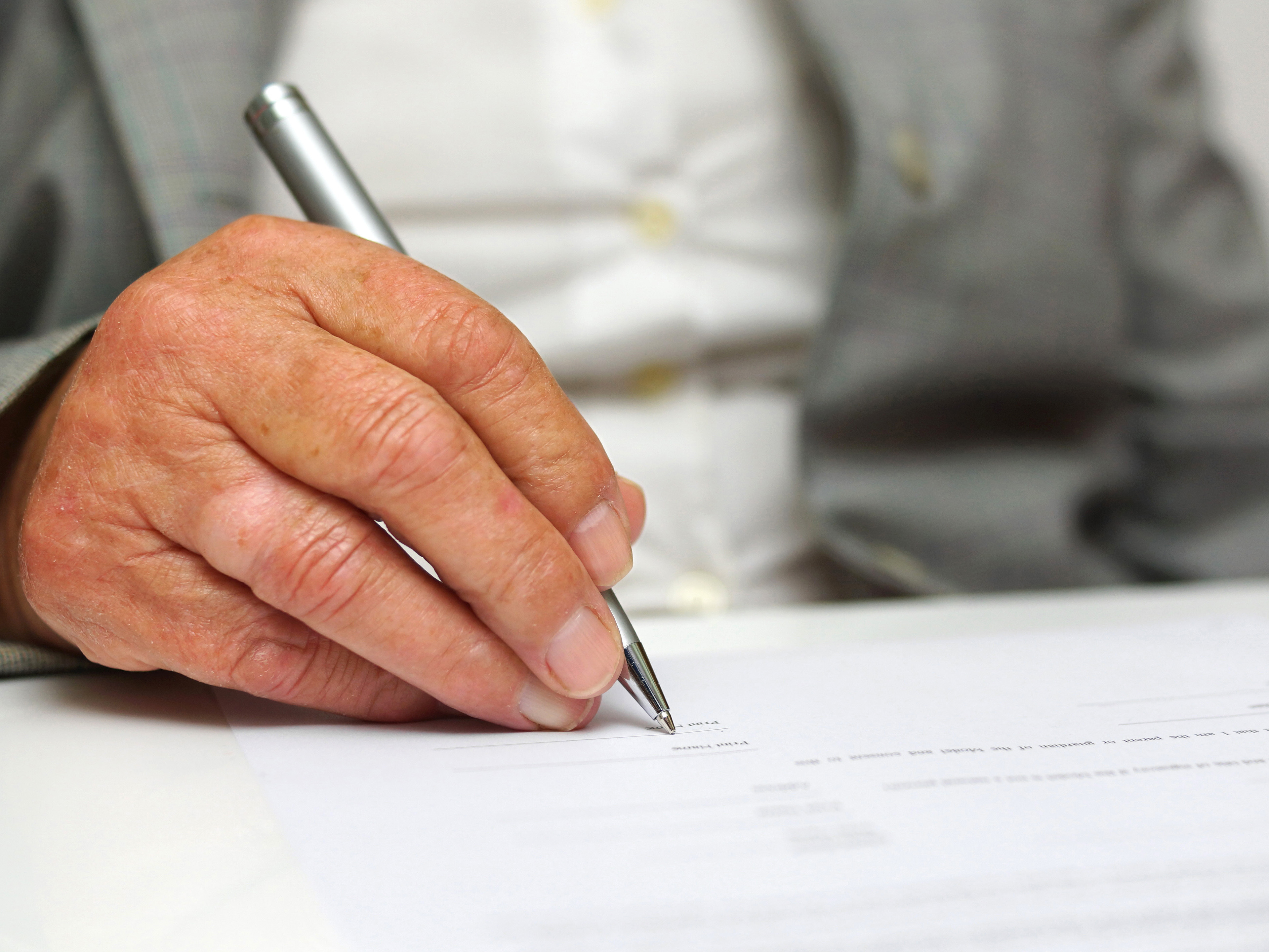 Person writing on paper