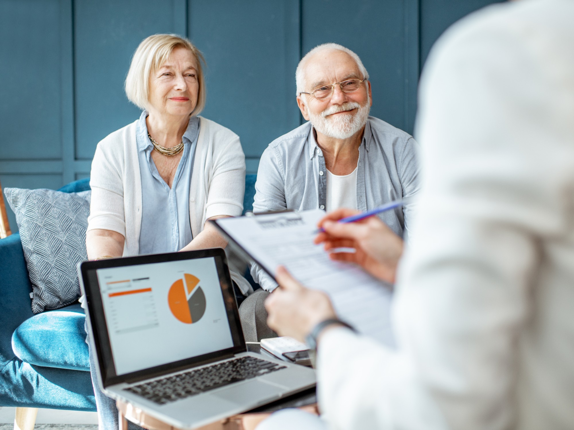 Older couple sitting with their financial advisor