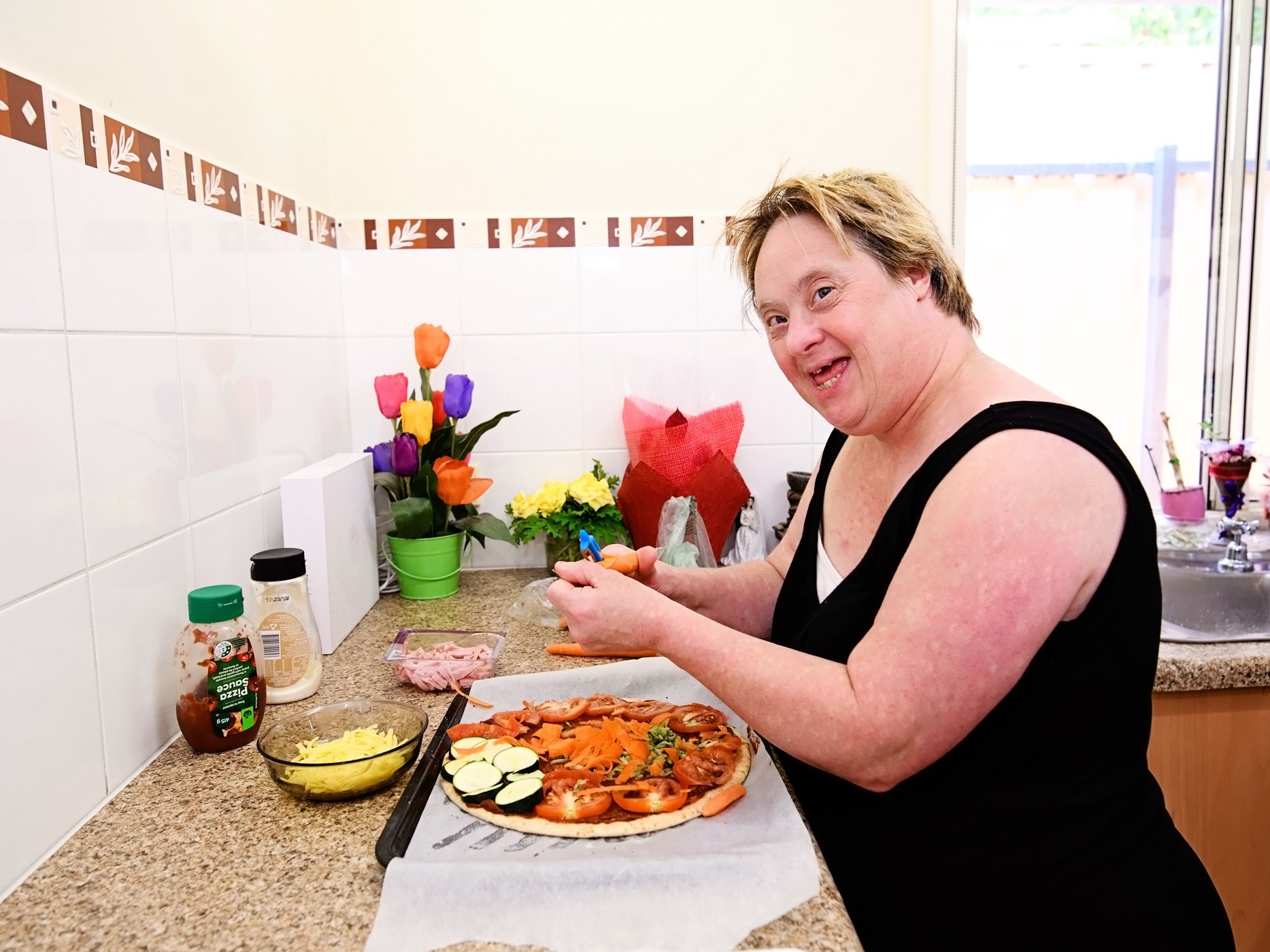 Woman cooking in her kitchen