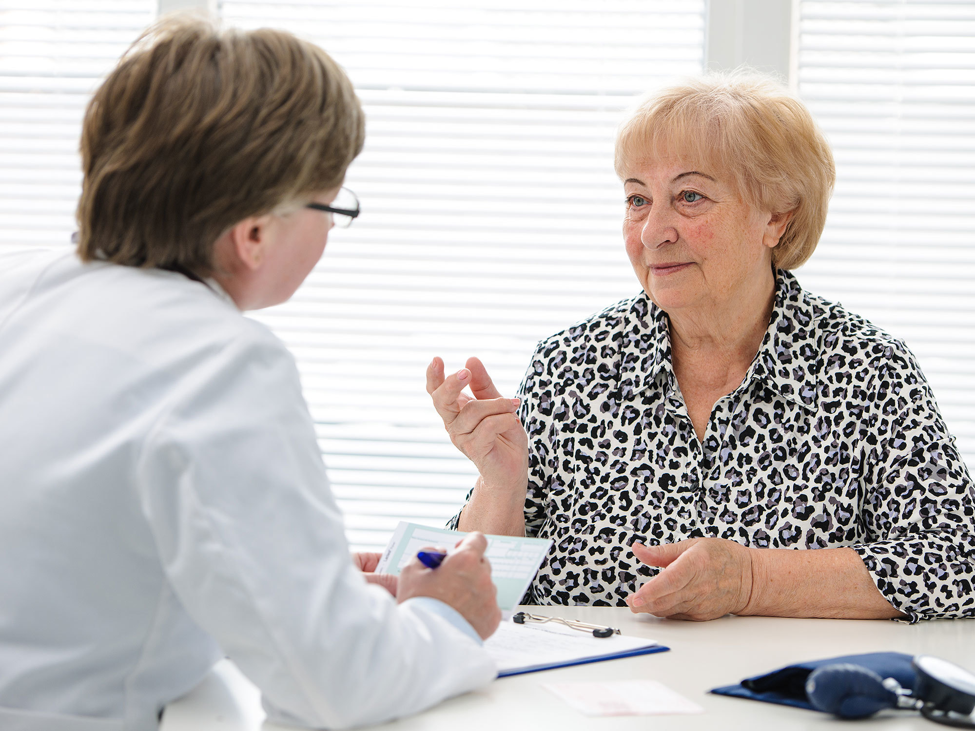 Older woman talking with her case manager