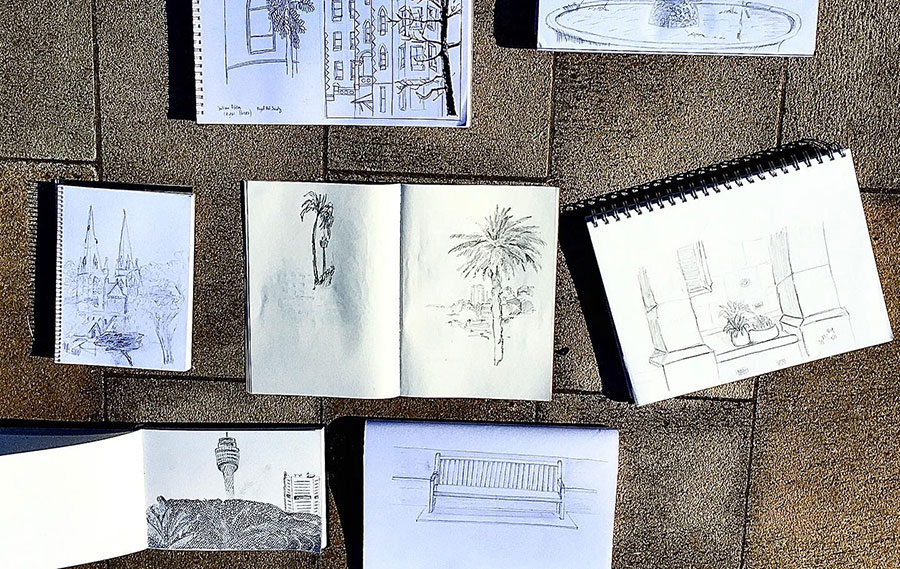 Art books with urban sketches laid on the floor 