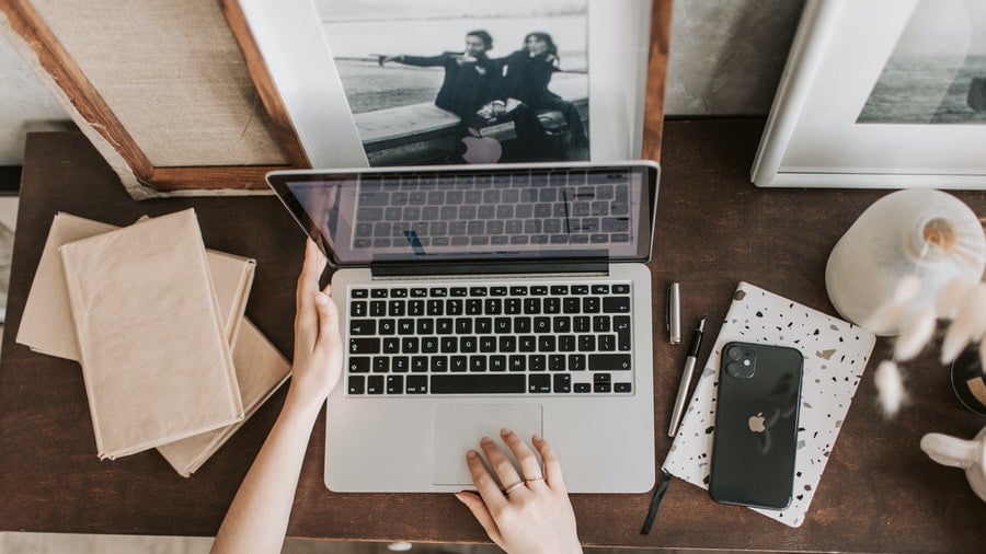 Lady using laptop in workspace