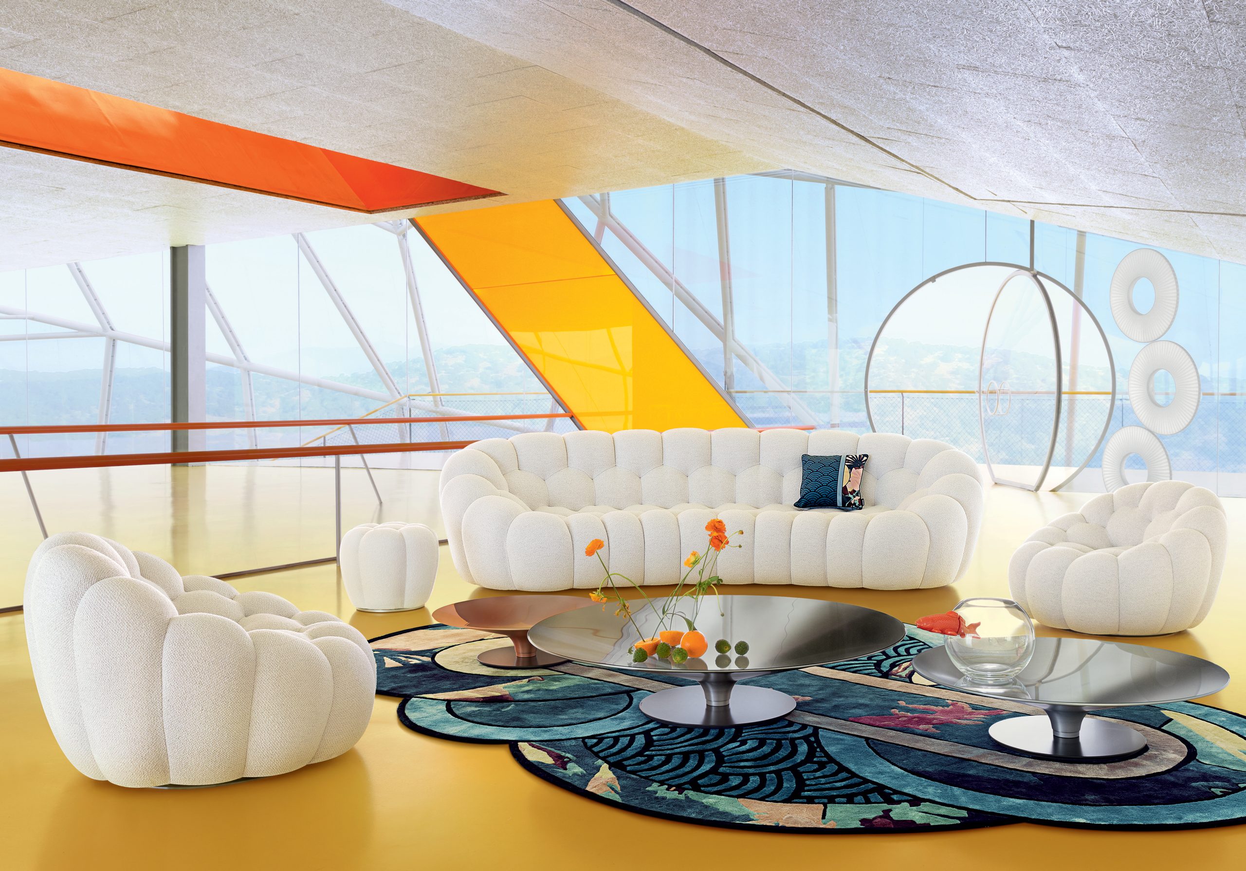 Greg Natale designer selects Roche Bobois padded white sofa in a colourful room