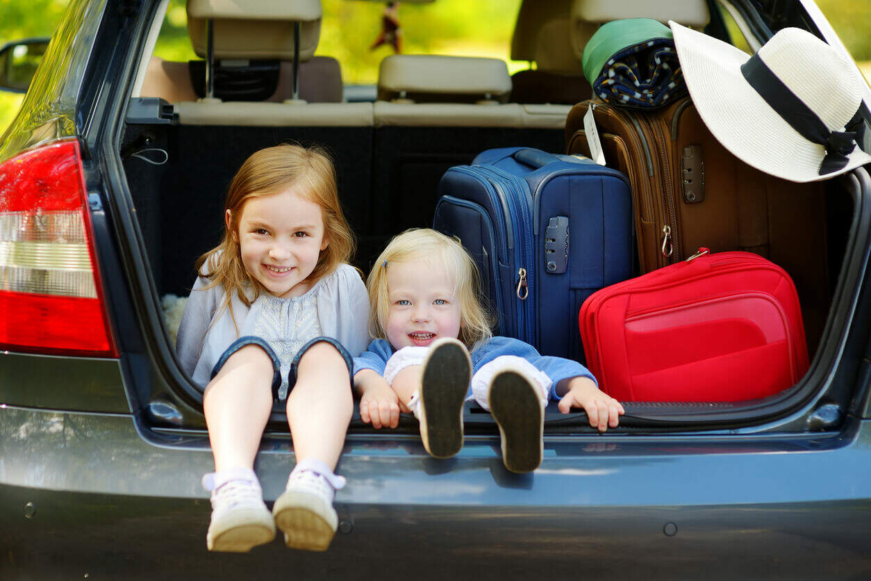 Children sitting in the back of a car