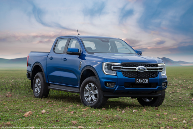 a ford ranger in a grassy field