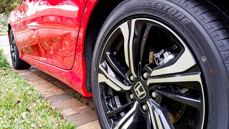 Bridgestone tyre on red Honda.