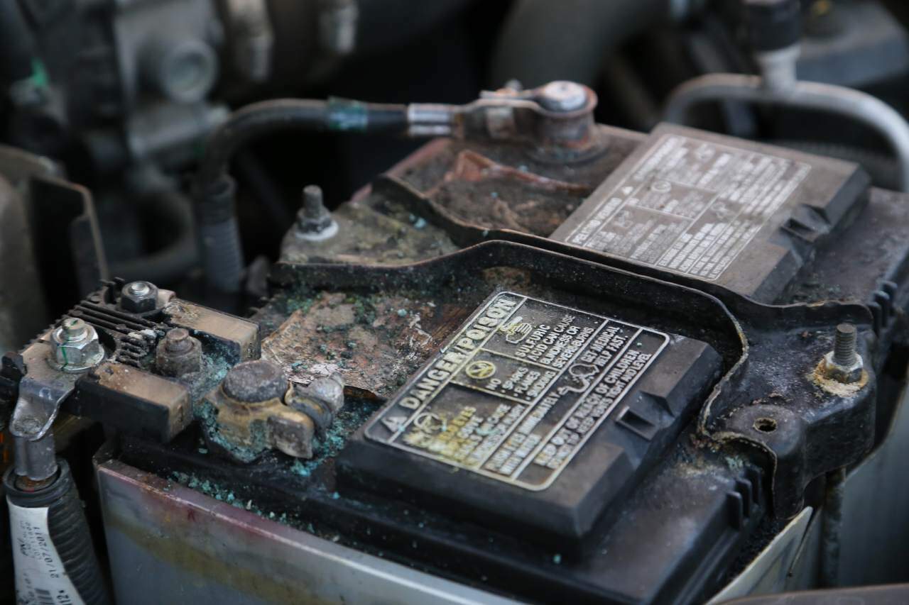 Damaged and corroded car battery