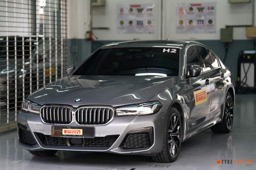 BMW sedan fitted with Pirelli P Zero 5 tyres inside workshop for performance testing