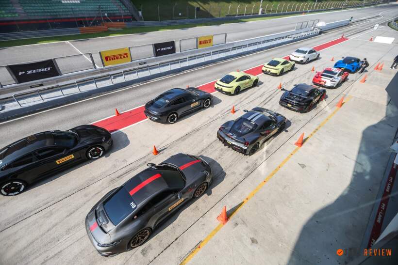 High-performance cars lined up in pit lane for Pirelli P Zero 5 track testing event