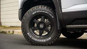 BFGoodrich All-Terrain tyre fitted on a pickup truck, showing white sidewall lettering and black alloy wheel