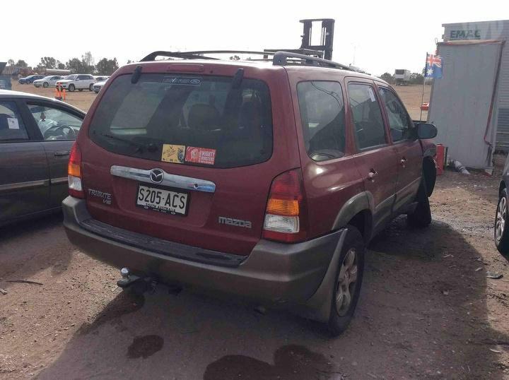 2002 Mazda Tribute Left Headlamp View Auto part Left Headlamp Mazda Tribute 2002