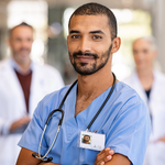 a graduate nurse standing in front of his colleagues
