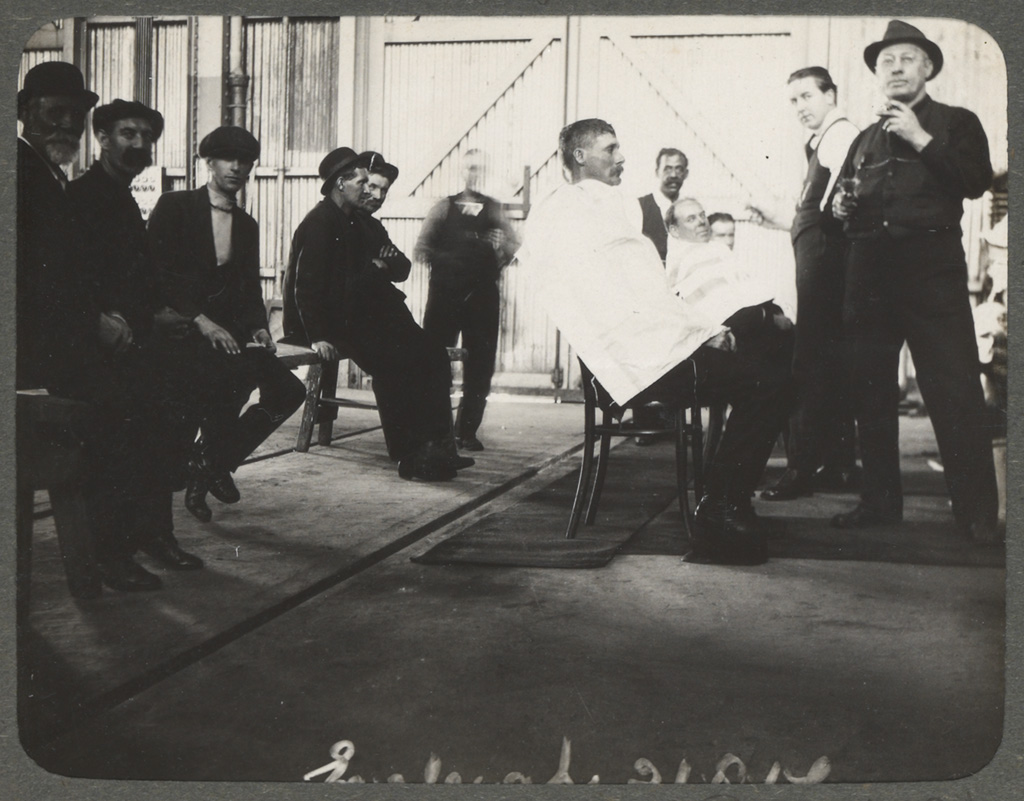 Photograph album of Eveleigh Workshops during the 1917 railway strike - Barbers in Paint shop Photograph album of Eveleigh Workshops during the 1917 railway strike - Barbers in Paint shop