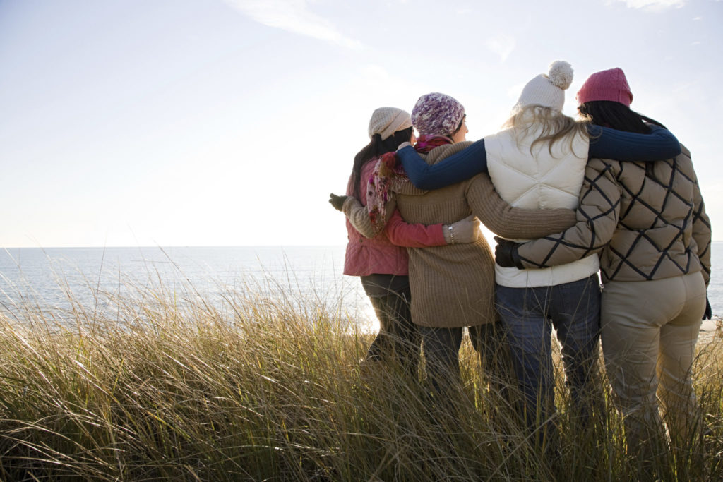 Female friends by the sea