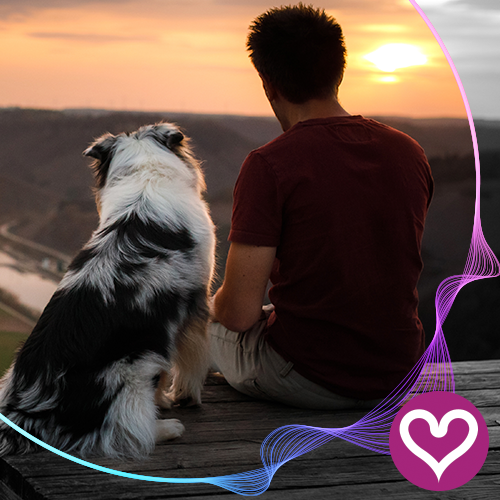 man sitting with dog