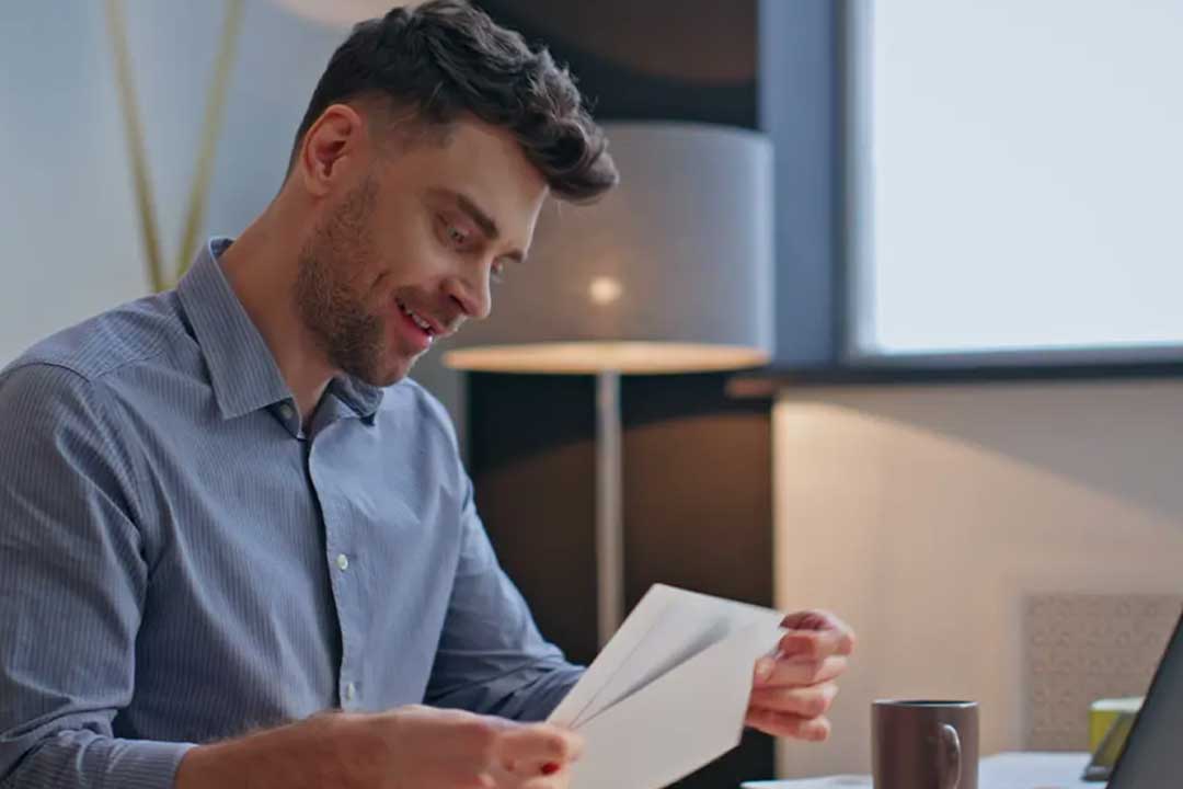 homeowner looking at bill happy