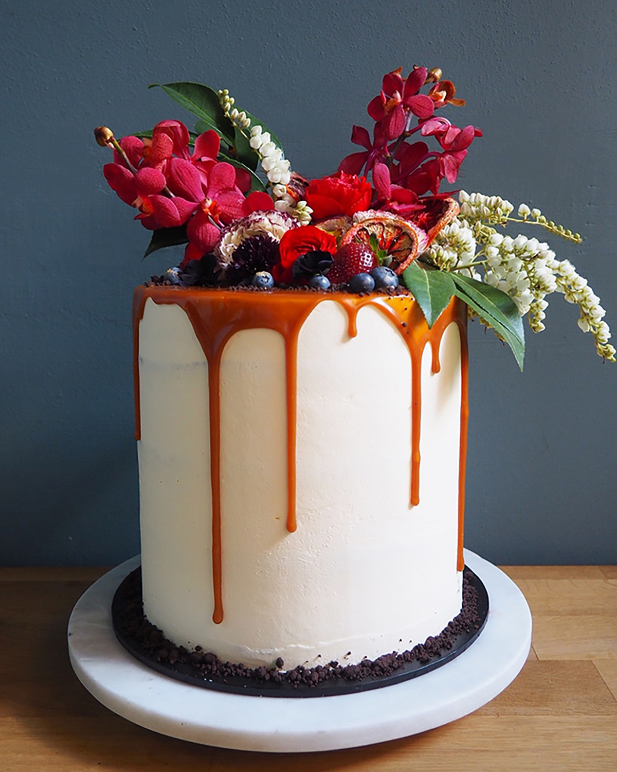 Caramel drizzle cake with red raspberries Image Polka Dot Bride
