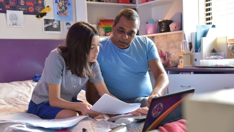 Dad helping daughter with homework