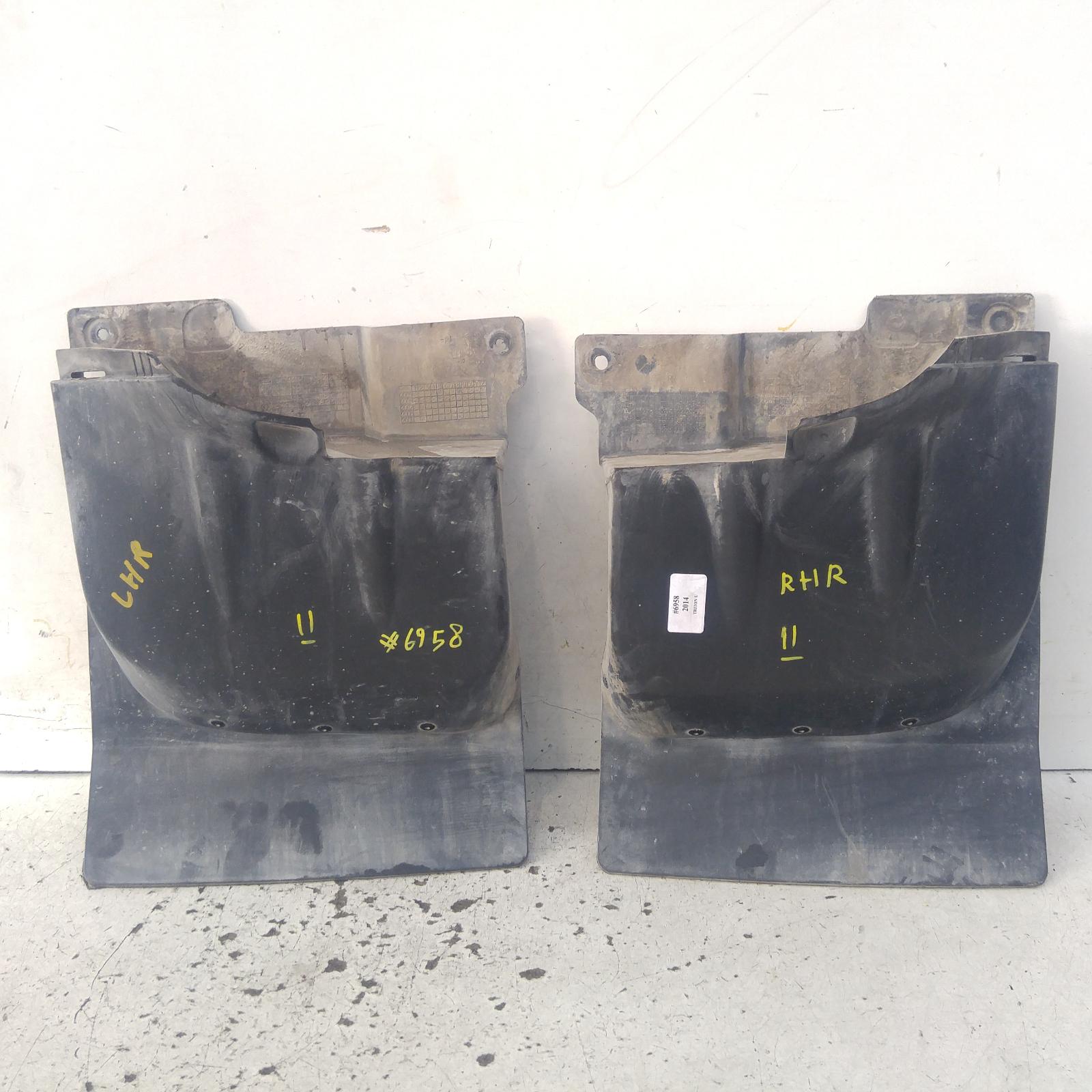 147141, Used mud flaps for 2014 triton lh rear, mn, w/ flares type