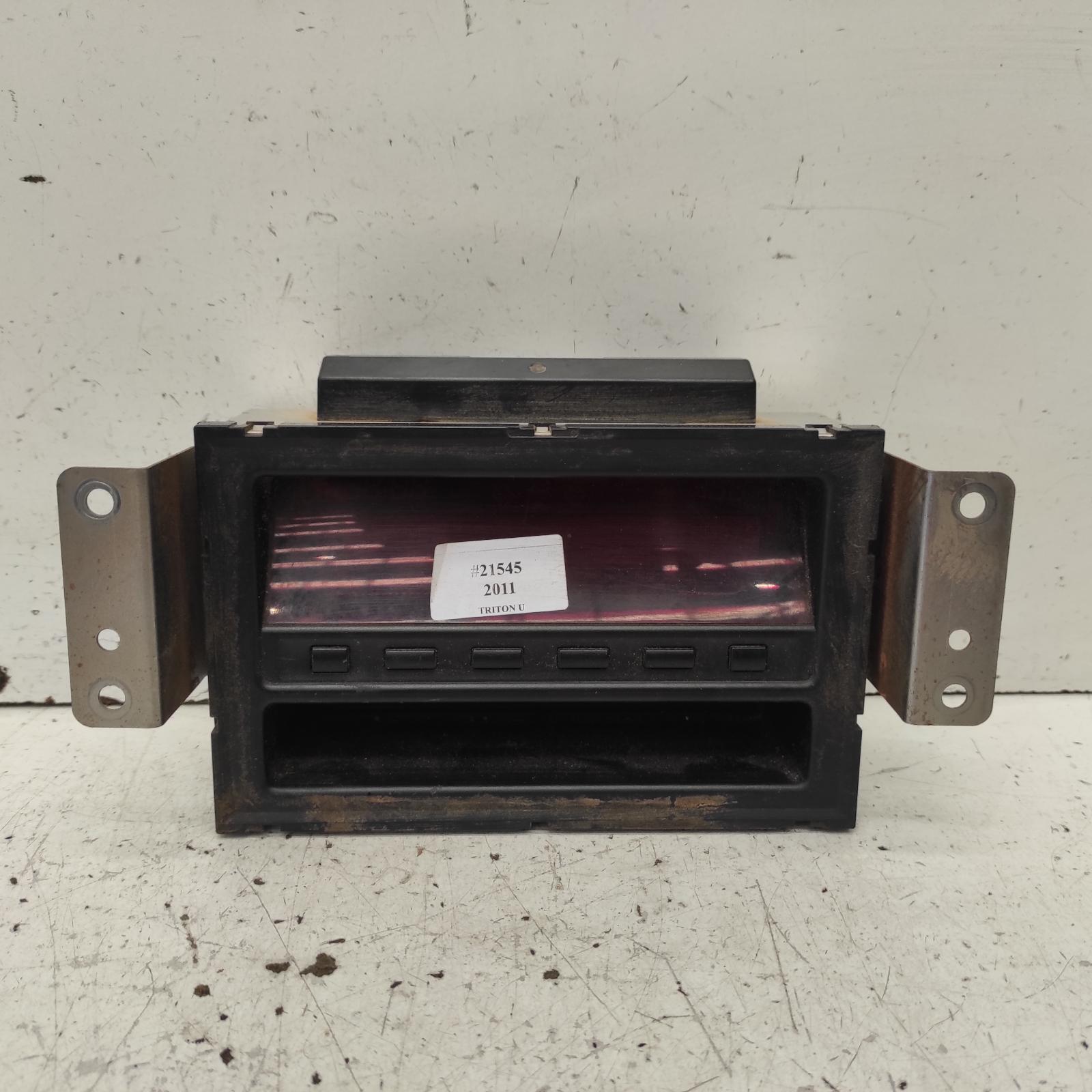 Triton Clock 2009-2015 centre dash,black buttons type,mn,08/09-04/15 00021545 #653596