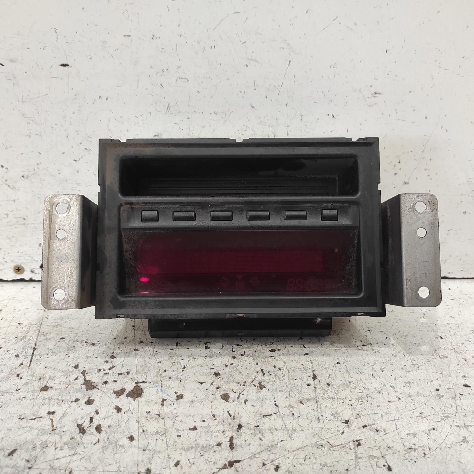 Triton Clock 2009-2015 centre dash,black buttons type,mn,08/09-04/15 00021673 #672306