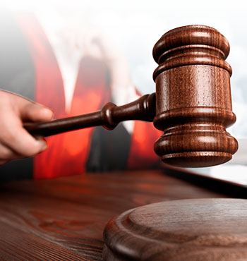judge and hand holding gavel