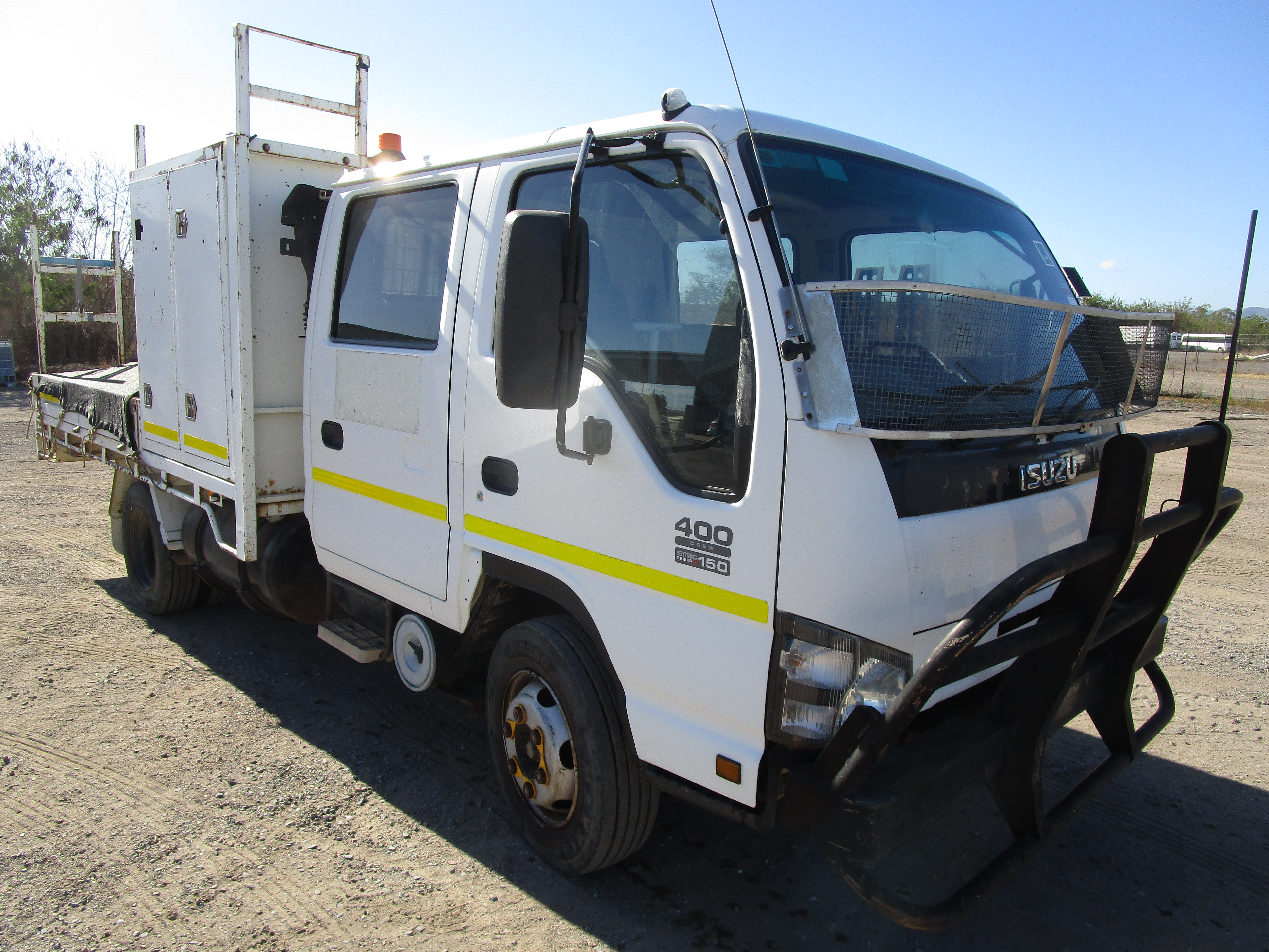 10 · 2005 ISUZU NPR 400 CREW   6x2 Tray Truck