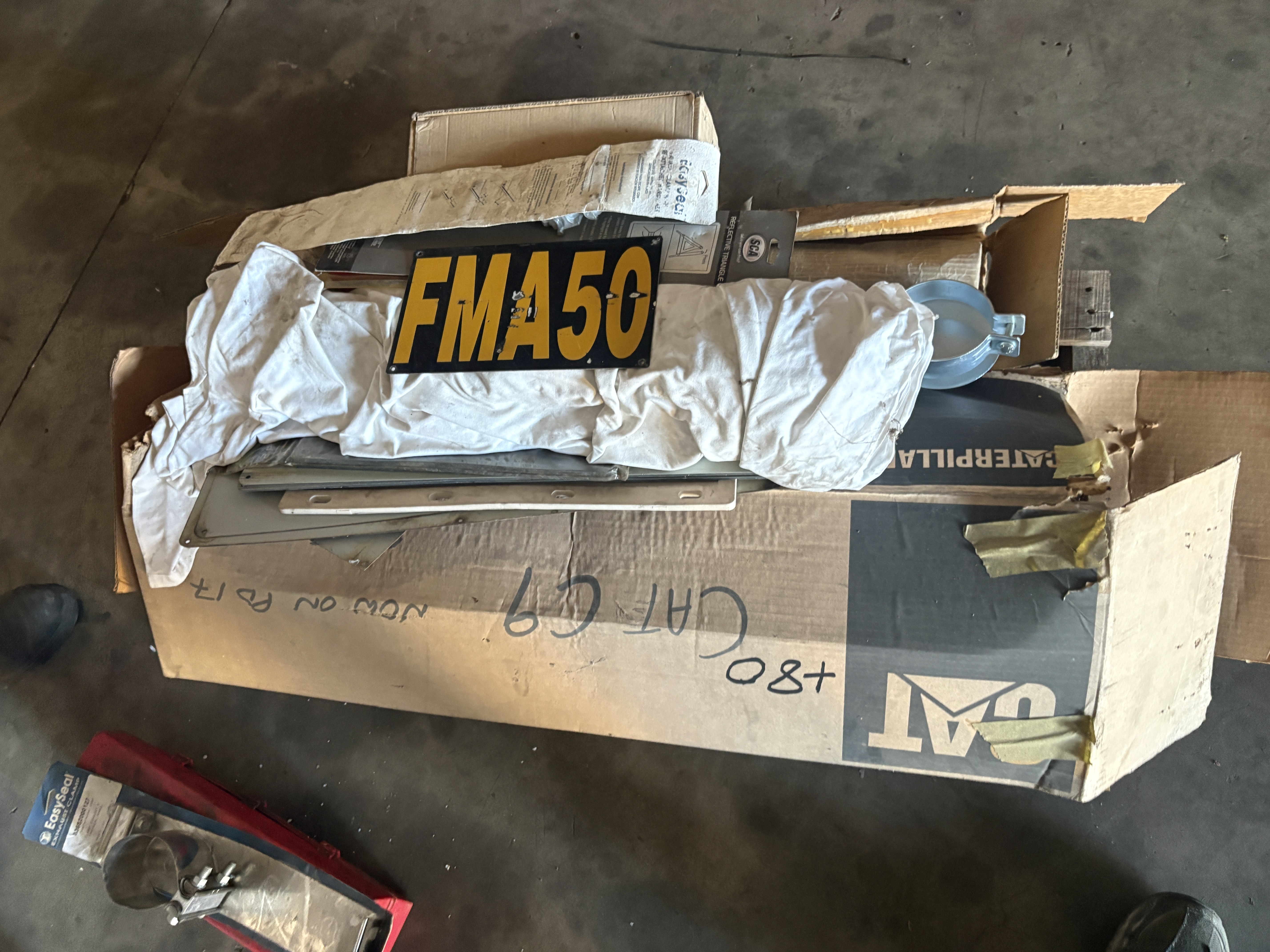 80 · “Pallet Of Cat/Harley Exhaust Parts”