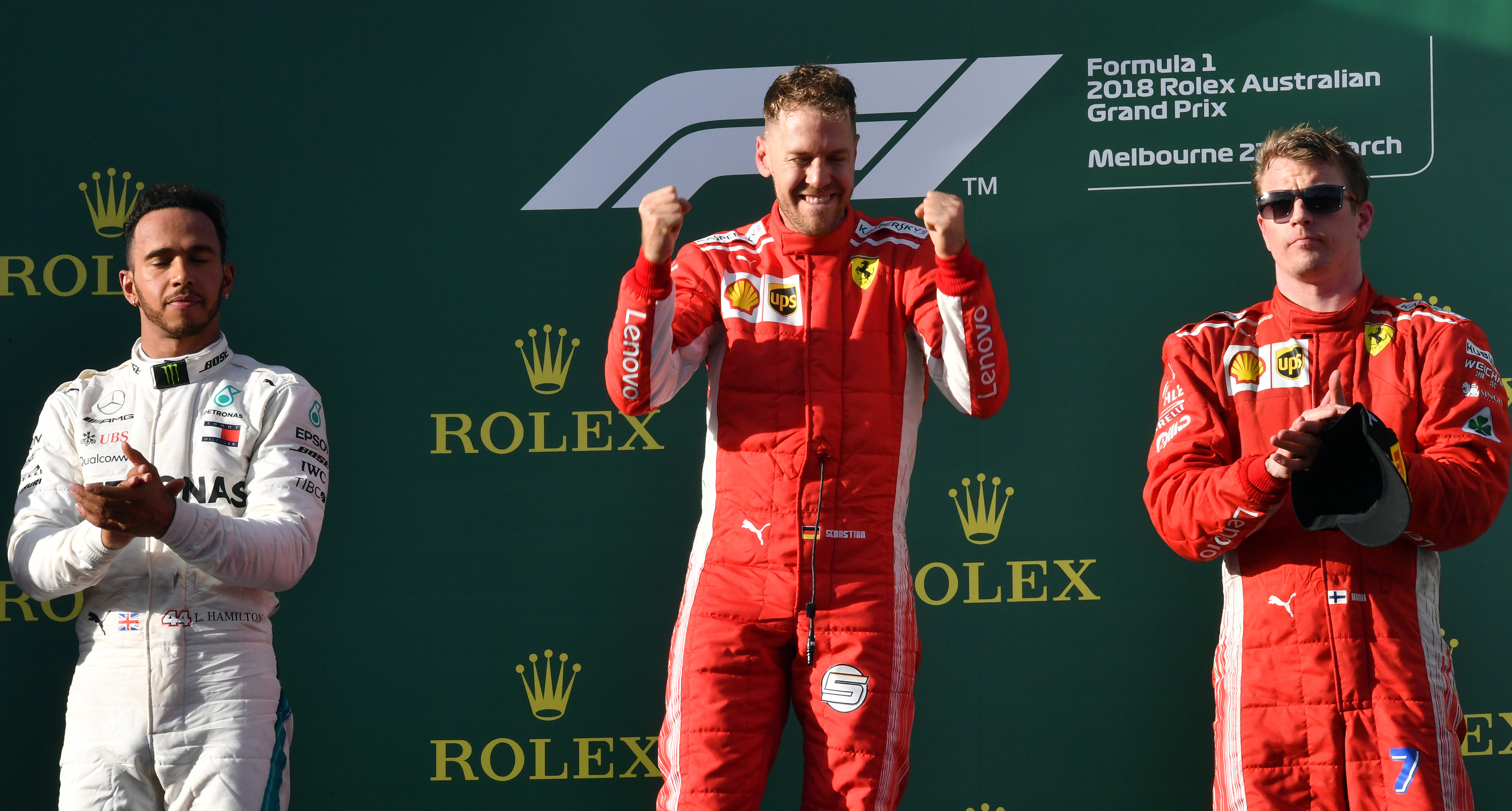 Sebastian Vettel (C) celebrates his victory on the podium next to second-placed Mercedes' British driver Lewis Hamilton (L) and third-placed Ferrari's Finnish driver Kimi Raikkonen (R) Pic: SAEED KHAN/AFP/Getty Images