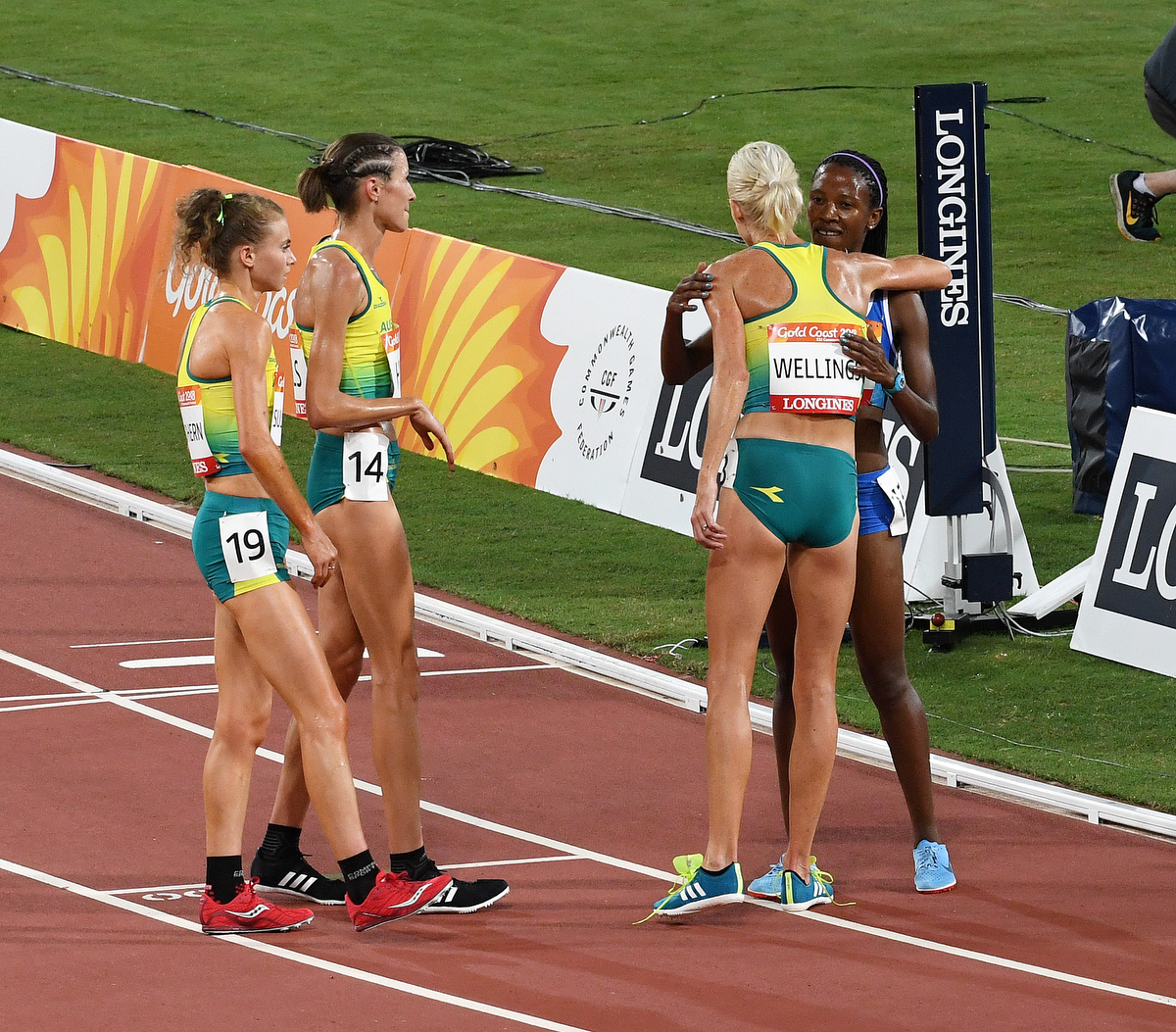 Celia Sullohern, Madeline Hills and Eloise Wellings at the finish line for rival Lineo Chaka. pic: Nick La Galle