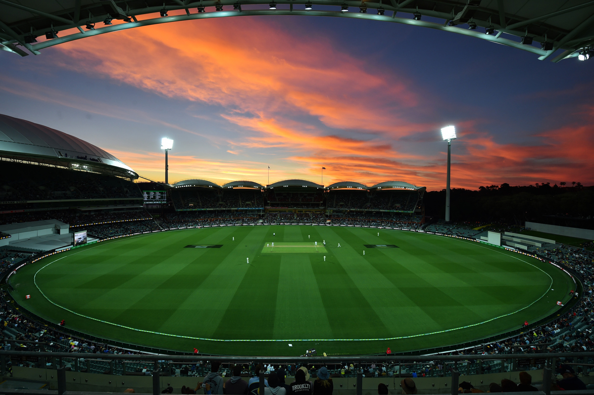 The sun sets during the first innings of the day-night third Test cricket match between Australia and South Africa at the Adelaide Oval. Pic: PETER PARKS/AFP/Getty Images